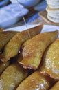 Pouring Syrup on Qatayef, Arabic Sweets with Nuts for Ramadan an
