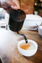 pouring tea , tea cup and tea pot Royalty Free Stock Photo