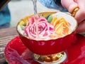 Pouring a tea into a red cup Royalty Free Stock Photo