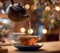 Pouring tea from teapot into china cup Royalty Free Stock Photo