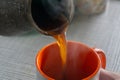 Pouring turkish coffee into a cup Royalty Free Stock Photo