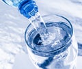 Pouring water from bottle into glass Royalty Free Stock Photo