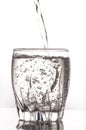Pouring water in a glass Royalty Free Stock Photo