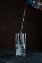 pouring water into a glass Royalty Free Stock Photo