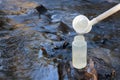 Pouring water sample for environmental study Royalty Free Stock Photo