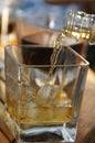 Pouring whisky in the glass Royalty Free Stock Photo