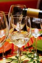 Pouring white wine Royalty Free Stock Photo