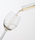 Pouring white wine into glass. Royalty Free Stock Photo