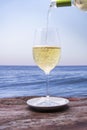 Pouring white wine Royalty Free Stock Photo