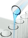 Pouringed liquid in laboratory glassware Royalty Free Stock Photo