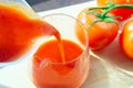 Pours a full glass of tomato juice. Healthy healthy product, dietary. close up selective focus Royalty Free Stock Photo