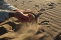 pours sand from his hands. Manual sifting of sand. Horizontal Photo Royalty Free Stock Photo