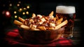 Poutine with beer on a plaid tablecloth. Royalty Free Stock Photo