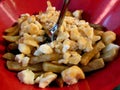 Poutine in red bowl