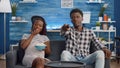 POV of african american parents sitting on couch Royalty Free Stock Photo