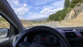 Pov of driver on rural road through steering whee Royalty Free Stock Photo