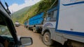 POV: Driving along an endless queue of cargo trucks waiting to cross the border