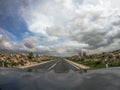 Pov driving a car on asphalt road in Andalusia.A power line cross the lane Royalty Free Stock Photo