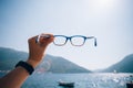 POV woman hold prescription glasses Royalty Free Stock Photo