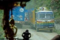 POV: Looking through the windshield of a jeep as trucks meet on narrow dirt road Royalty Free Stock Photo