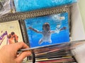 POV: Male Hand Buying Nirvana Iconic CD