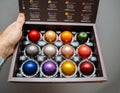 POV male hand holding unboxing new package of with multiple colorful Nespresso