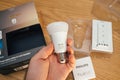 POV male hand unboxing unpacking new Philips Signify HUE smart light for home