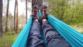 Pov of man lying in hammock in forest