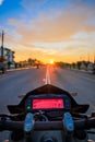 POV Motorbike Speedometer Against The Setting Sun on the Highway