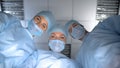 Pov patient waking up after operation anesthesia, smiling surgeon team faces Royalty Free Stock Photo