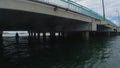 POV from a personal watercraft in the Florida Keys going under a bridge