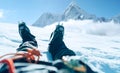POV shoot of a high altitude mountain climber`s lags in crampons. He lying and resting on snow ice field with Ama Dablam 6812m Royalty Free Stock Photo