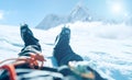 POV shoot of a high altitude mountain climber`s lags in crampons. He lying and resting on snow ice field with Ama Dablam 6812m Royalty Free Stock Photo