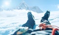 POV shoot of a high altitude mountain climber`s lags in crampons. He lying and resting on snow ice field with Ama Dablam 6812m Royalty Free Stock Photo