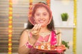 POV Shot of Indian married woman in traditional dress see through sieve during Hindu Indian religious karwa chauth