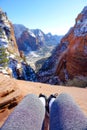 POV: Sitting on a red sandstone ledge and looking at the gorgeous wintry canyon