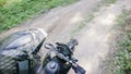 POV slow-motion shot of the rider`s hand and part of motard`s black motorcycle