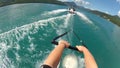 POV view of waterskiing. Water ski summer sports action camera, blue water lake.