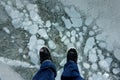 POV: Walking in your sneakers across a beautiful frozen lake in Alberta, Canada. Royalty Free Stock Photo