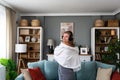 POV of young happy woman or girl dancing in the new apartment in boyfriend shirt and wireless headset happy that she and her Royalty Free Stock Photo