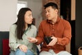 Povertry and debt concept. Unhappy asian middle aged man and young woman having financial problems Royalty Free Stock Photo
