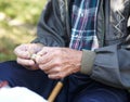 Elderly poor man eating bread