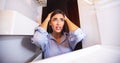 Desperate woman looking at empty fridge at home Royalty Free Stock Photo