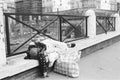 Poverty, homeless woman sleeping on the street.
