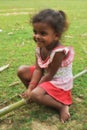 Poverty, portrait of a poor little African girl lost in deep thoughts Royalty Free Stock Photo