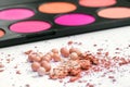 Powder in the balls with a radiant effect on the background of the set for blush. Make-up cosmetics, Royalty Free Stock Photo