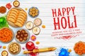 Powder color gulal and gujiya sweet with thandai for Happy Holi Background Royalty Free Stock Photo