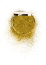 Powder highlighter in a gold powder box with gold sparkles reflected in the mirror. Isolated on white background.