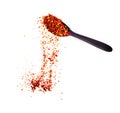 powder paprika with wooden spoon flying scoop isolated on white background Royalty Free Stock Photo