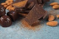 Powder and pieces of tasty chocolate. Royalty Free Stock Photo